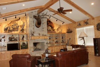 Referred to as the lodge. The lueders stone fireplace, white pine beams, and vertical pine walls create a welcoming space to entertain friends and family.